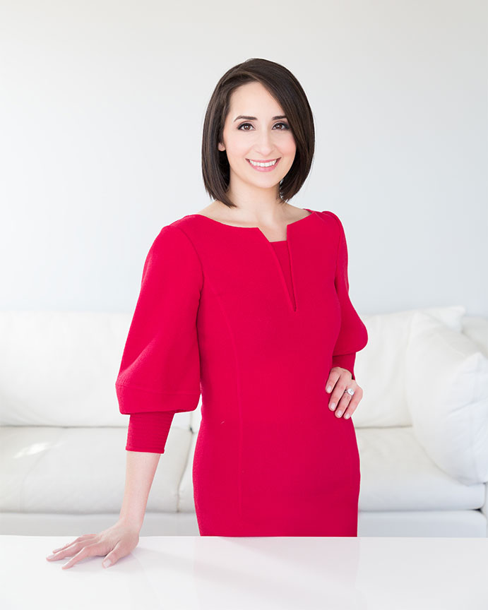 portrait of woman attorney wearing red dress
