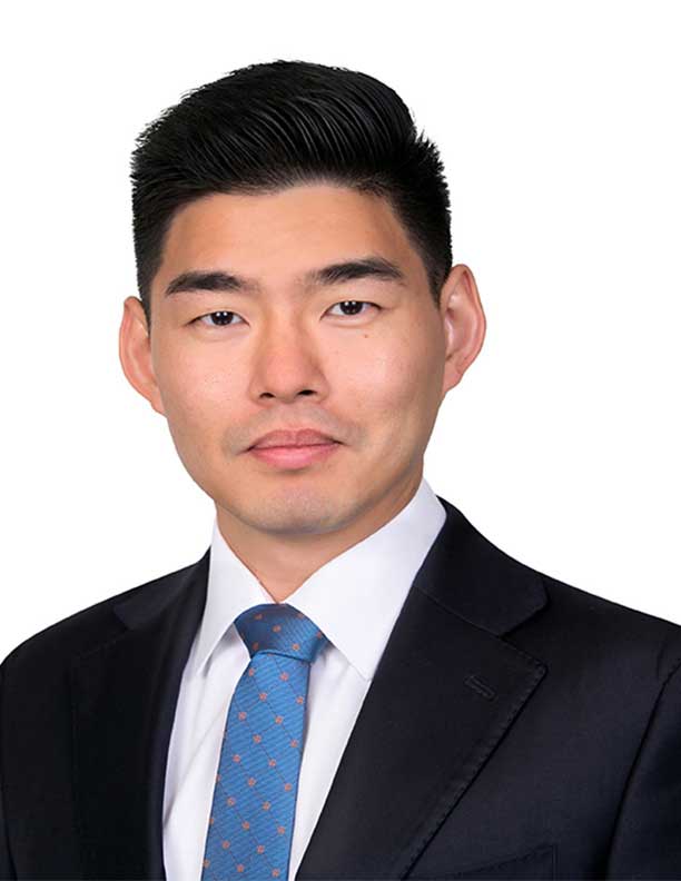 corporate headshot of man with blue tie slight smile on white background Irvine CA