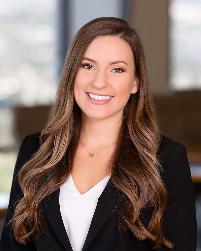 Professional Headshots of Woman Attorney shot at Newport Beach Office Location with Blurry Background
