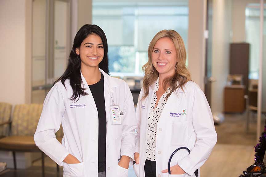 posed photo of 2 female doctors at work